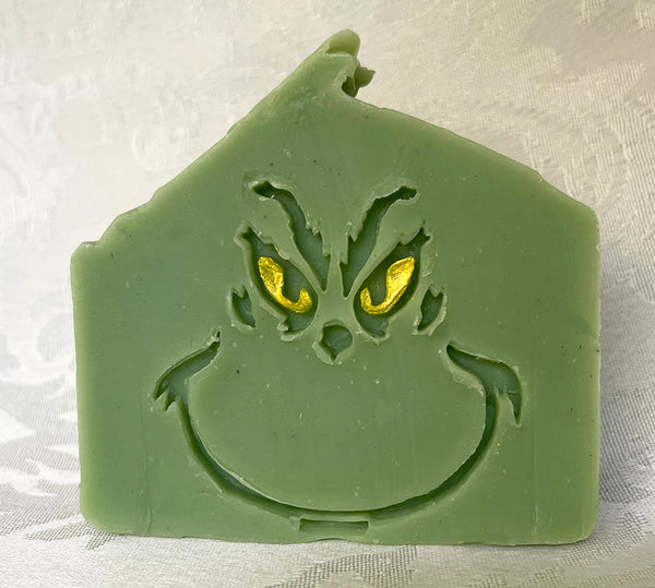 green soap face with yellow eyes