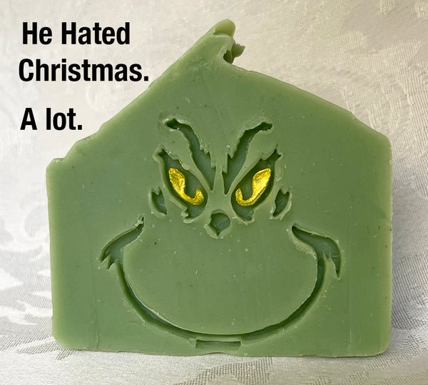 Green grinning face with yellow eyes soap